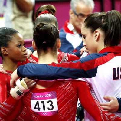 US gymnast Alexandra Raisman (C) and teammates react during the women's team final of the artistic gymnastics event of the London Olympic Games on July 31, 2012 at the 02 North Greenwich Arena in London.