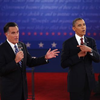 HEMPSTEAD, NY - OCTOBER 16: Republican presidential candidate Mitt Romney (L) and U.S. President Barack Obama talk over each other as they answer questions during a town hall style debate at Hofstra University October 16, 2012 in Hempstead, New York. During the second of three presidential debates, the candidates fielded questions from audience members on a wide variety of issues. (Photo by John Moore/Getty Images)