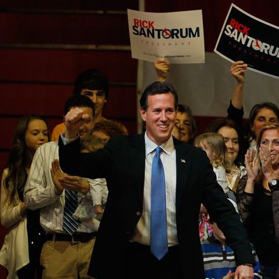 STEUBENVILLE, OH - MARCH 06: Republican presidential candidate, former U.S. Sen. Rick Santorum arrives on stage during a primary night party at the Steubenville High School Gymnasium on March 6, 2012 in Steubenville, Ohio. The Republican Party continues the process of deciding if Republican presidential candidate, former Massachusetts Gov. Mitt Romney, Republican presidential candidate, U.S. Rep. Ron Paul (R-TX) or Republican presidential candidate, former Speaker of the House Newt Gingrich will be their general election candidate against President Barack Obama in the fall. (Photo by Joe Raedle/Getty Images)