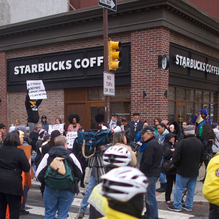 Protestors demonstrate outside a Center City Starbucks on April 15, 2018 in Philadelphia, Pennsylvania. Philadelphia Police arrested two black men in the same Center City Starbucks, which prompted an apology from the company's CEO.