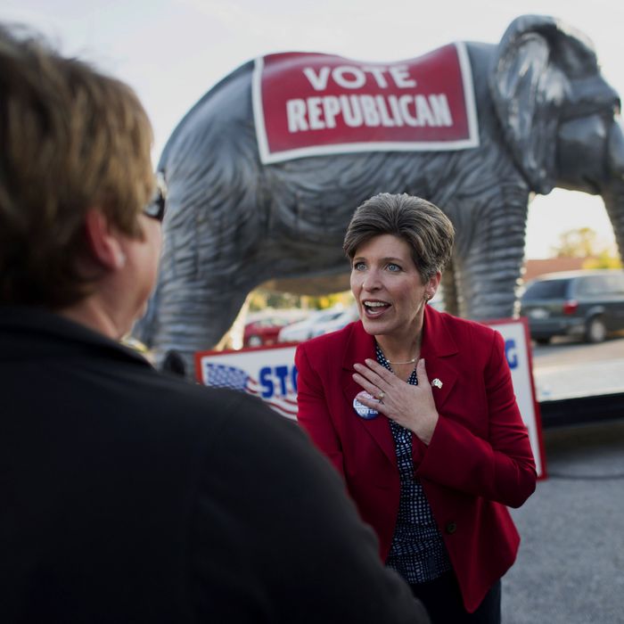 Republican Joni Ernst, running for the U.S. Senate in Iowa, speaks with an attendee during a campaign stop in Davenport, Iowa, U.S., on Thursday, Sept. 25, 2014. In Iowa, where a woman never has been elected to the U.S. Senate or governor, Republicans think their female candidate, Ernst, will enable them to reduce the gender gap. 
