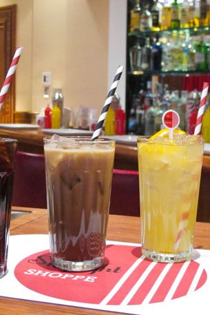 From left, The Skylight Shoppe Cola garnished with cherries; Homemade Manhattan Special; Blood Orange Creamsicle garnished with mint springs; The Jamaican tropical citrus with orange garnish.