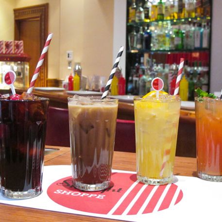 From left, The Skylight Shoppe Cola garnished with cherries; Homemade Manhattan Special; Blood Orange Creamsicle garnished with mint springs; The Jamaican tropical citrus with orange garnish.